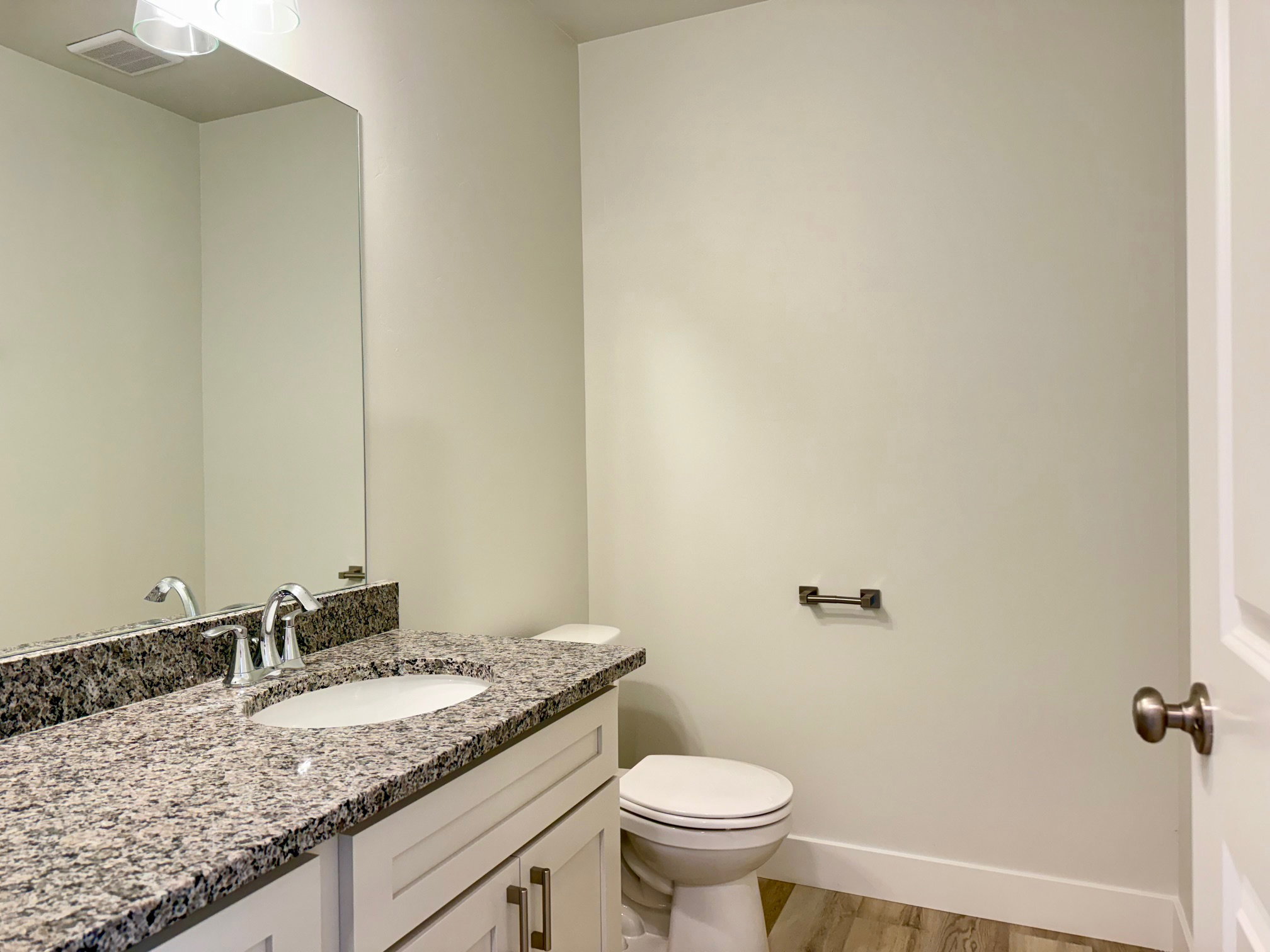 Bathroom featuring vanity and light wood-style flooring