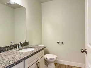 Bathroom featuring vanity and light wood-style flooring
