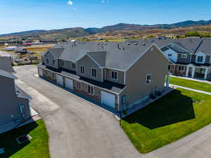Aerial view of residential area featuring a mountain backdrop