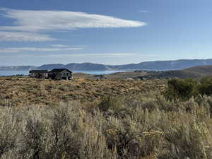 View of mountain backdrop with a nearby body of water