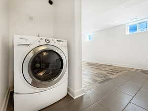 Laundry room featuring washer / clothes dryer, wood tiled floors, and recessed lighting
