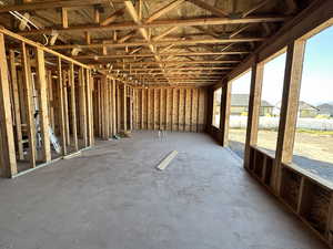 Misc room featuring unfinished concrete floors