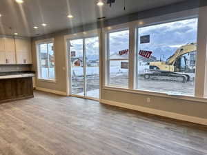 Unfurnished dining area featuring light wood-style floors and recessed lighting
