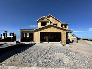 Unfinished property with gravel driveway