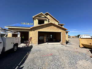 Property under construction featuring a garage