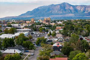 Aerial perspective of suburban area with a mountain backdrop