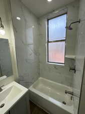 Full bathroom with vanity and tub / shower combination