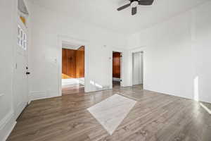 Spare room featuring wood finished floors and a ceiling fan