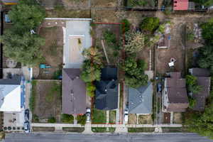 Aerial view of property and surrounding area with property parcel outlined