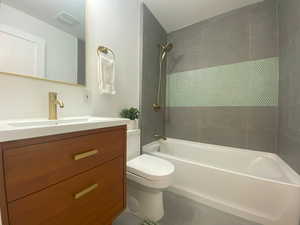 Full bath featuring shower / washtub combination, vanity, and tile patterned floors