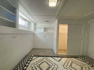 Bathroom with concrete block wall
