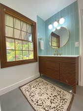 Bathroom featuring baseboards and vanity