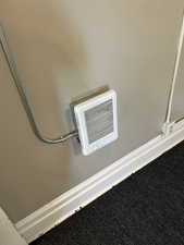 Detailed view of heating unit and carpet flooring