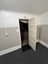 Detailed view of a textured ceiling and carpet