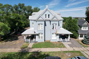 Victorian house with a porch and a chimney