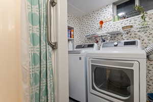 Washroom with washing machine and dryer