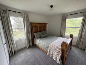 Carpeted bedroom with baseboards