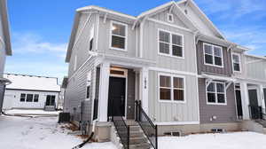 View of front of home featuring entry steps and board and batten siding