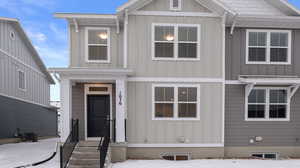 View of front of home with board and batten siding