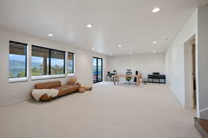 Rec room featuring an office area, carpet flooring, recessed lighting, and a mountain view