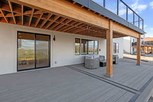 Wooden deck featuring outdoor lounge area