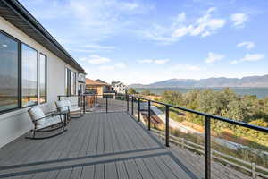 Wooden terrace with a water and mountain view