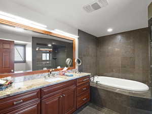En suite bath in primary bedroom-Full  soaking tub!