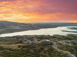 Aerial view at dusk of a water and mountain view