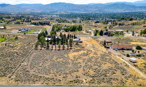 Overview of rural landscape featuring a mountain backdrop