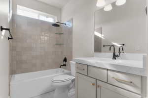 Bathroom featuring bathtub / shower combination and vanity