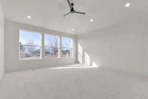 Empty room featuring ceiling fan, carpet flooring, and recessed lighting