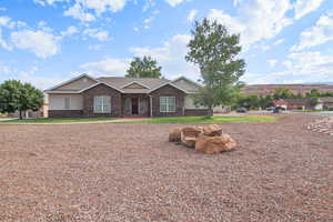 Ranch-style home with stucco siding and brick siding