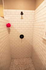 Full bath with a tile shower