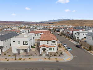 Aerial perspective of suburban area featuring a mountain backdrop