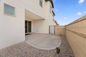 Fenced backyard with a patio area