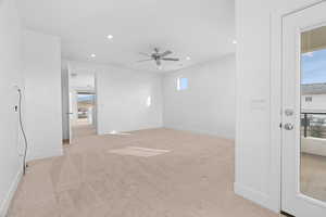 Empty room with light colored carpet, recessed lighting, and ceiling fan