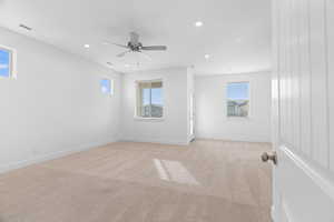 Spare room with light colored carpet, recessed lighting, and ceiling fan