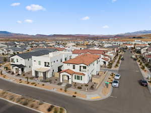 Aerial perspective of suburban area featuring a mountainous background