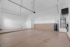 Garage with secured water heater and baseboards