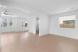 Unfurnished living room with recessed lighting, light wood finished floors, and a ceiling fan