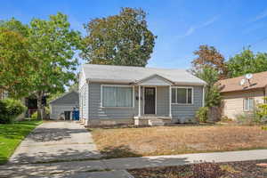 Bungalow-style home with an outdoor structure and a garage