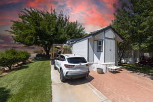 View of property exterior with a yard