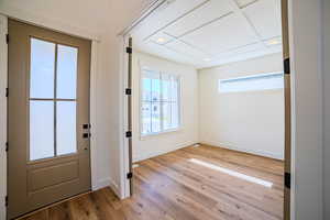 Doorway to outside featuring hardwood / wood-style floors and recessed lighting