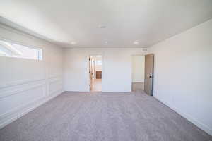 Unfurnished bedroom featuring light colored carpet and recessed lighting