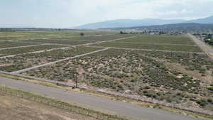 Aerial view of sparsely populated area with a mountain backdrop