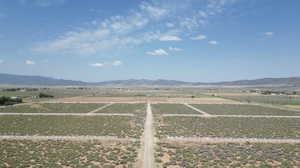 View of mountain background featuring rural landscape
