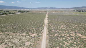 Aerial view of sparsely populated area featuring a mountain backdrop
