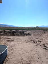 View of mountain background featuring rural landscape and large plots for crops