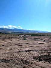 View of mountain backdrop with rural landscape