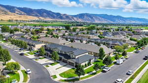 Aerial view of residential area featuring a mountainous background